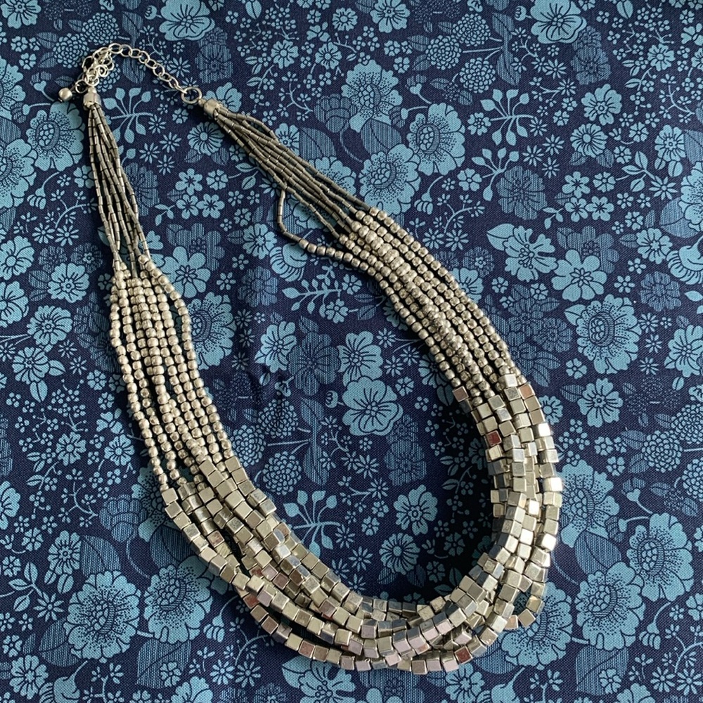 Beautiful 7 strand silver beaded necklace. Maximum length is 22” total. EUC.